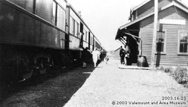 Photo of people receiving mail off a train stopped in Valemount, British Columbia