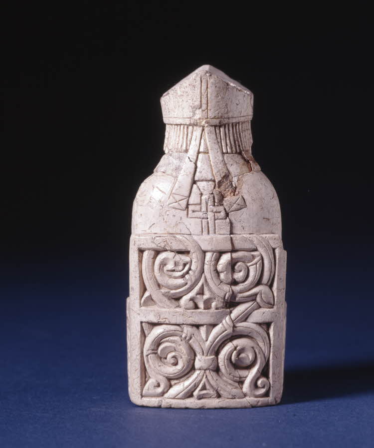 Photo of rear view of seated Lewis bishop.