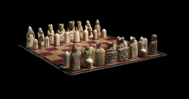 Photo of Lewis chessmen on a chess board.
